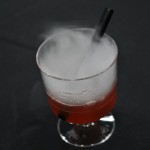 A berry drink with dry ice for show!