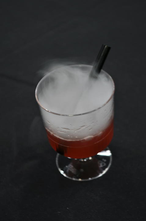 A berry drink with dry ice for show!