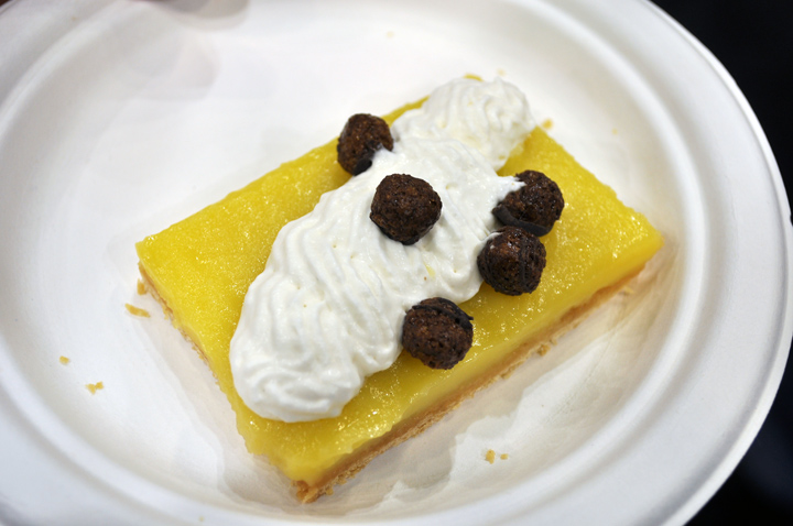 Lemon square with vanilla cream and chocolate balls