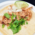 Carnitas taco with cilantro and lime