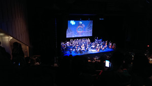 The orchestra has returned to the stage following the intermission.