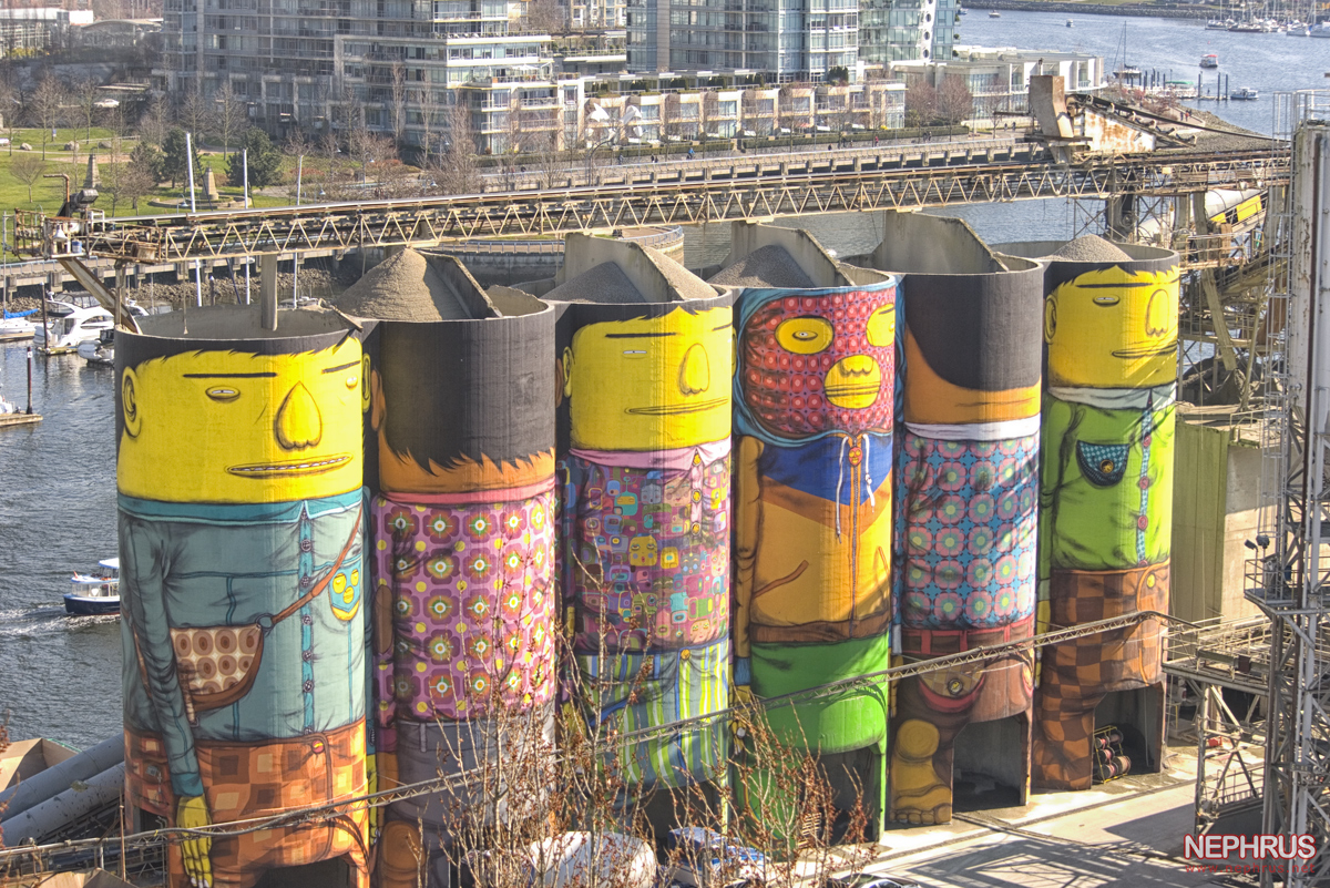 An aerial view of OSGEMEOS’ artwork on the Ocean Cement silos seen from the Granville Street Bridge.